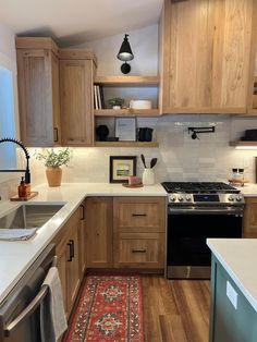 the kitchen is clean and ready for us to use it's new stove top