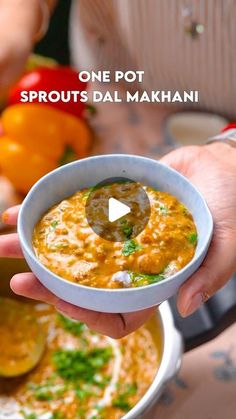 a person holding a bowl of soup in their hand with the caption, one pot sprouts dal makhani