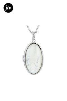 Paula Deen Jewelry 34x19mm oval white mother-of-pearl rhodium over brass locket enhancer with 18" chain. Measures approximately 1.94"L x 0.95"W. Lobster clasp. 2" extender. Elegant White Oval Pendant Locket Necklace, Elegant White Locket Necklace For Anniversary, Elegant White Locket Necklace, White Oval Pendant With Polished Finish, Oval Mother Of Pearl Necklace, Silver Oval Pearl Drop Necklace, Silver Oval Necklace With Pearl Drop, Elegant Oval Nickel Free Necklace, Elegant Oval Nickel-free Necklace