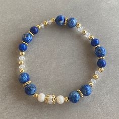 Lapis Lazuli Gemstone and White Pearl Bracelet Arrives ready for gifting and usually ships same day or next day. The necklace will be sent with a gift! O T H E R ∙ I N F O R M A T I O N Lapis Lazuli size: 8 mm Lapis Lazuli size: 6 mm Pearl size: 5-6 mm Crystal size: 3 mm **Intermediate apparatus and beads are non-tarnish gold plated. ☆ Each of our bracelets at PEARLOWNJEWELRY are handmade and special natural stones. Bracelet and necklace are made with positive energy. Each crystal is cleaned bef Spiritual Blue Lapis Lazuli Beaded Bracelets, Adjustable Lapis Lazuli Bracelet With Round Beads, Adjustable Lapis Lazuli Beaded Bracelet With Faceted Beads, Blue Pearl Bracelet With Gemstone Beads As A Gift, Blue Pearl Bracelet With Gemstone Beads For Gift, Blue Beaded Bracelets For Meditation, Adjustable Lapis Lazuli Beaded Bracelets, Hand-strung Blue Spiritual Bracelets, Blue Hand-strung Spiritual Bracelets