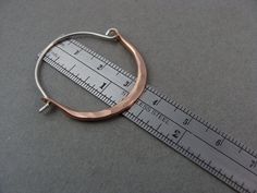 "These delicate 14k rose gold filled hoops have been hand formed and connect to a hammered sterling silver ear wires. The metal has been hammered to be wider at the bottom and given a gentle curve. Unique, simple and perfect for everyday. Size ~ Approximately 1 1/8\" X 1 1/2\" ☞ Each pair is made by hand, expect slight variation. Be sure to check out my shop to find more size and color options. https://www.etsy.com/shop/sirenjewels ★ Shipping ~ Domestic orders are sent USPS first class and a tra Hammered Rose Gold Sterling Silver Hoop Earrings, Rose Gold Hammered Sterling Silver Hoop Earrings, Gemstone Hoop Earrings, Gold Filled Hoops, Hammered Sterling Silver, Hammered Gold, Moonstone Pendant, Gold Art, Gold Hoops