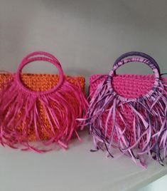 Crochet Raffia Top Handle Tote with Fringes - Colorful Tassel Tote Bag for Summer - Fringe Handbag - Hobo Bag with Boho Style - Wicker Beach Bag  Elevate your summer style with this vibrant crochet raffia top handle tote, adorned with playful fringes and colorful tassels. Perfect for beach days or casual outings, this hobo bag exudes boho charm with its blend of pink and orange hues. Ideal for carrying your essentials with flair, this handcrafted tote combines style and functionality effortlessl Pink Rectangular Tassel Bag, Pink Bags With Tassels For Daily Use, Rectangular Pink Bag With Fringe, Pink Fringe Shoulder Bag, Pink Tassel Bag For Travel, Pink Fringe Bag For Daily Use, Pink Beach Bag With Detachable Handle, Multicolor Tassel Pouch Bag, Pink Fringe Bag For Everyday Use