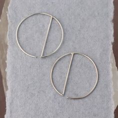 • Sterling Silver Geometric Hoop Earrings -- silver circles with a vertical dividing line, super minimalist and easy to wear• READY TO SHIP • Just over one inch long and wide Modern Metal Round Cartilage Earrings, Modern Round Metal Cartilage Earrings, Minimalist Hypoallergenic Circle Earrings, Minimalist Hypoallergenic Open Circle Earrings, Minimalist Metal Round Cartilage Earrings, Minimalist Round Metal Cartilage Earrings, Minimalist Metal Cartilage Earrings For Everyday, Minimalist Everyday Metal Cartilage Earrings, Modern Nickel Free Cartilage Earrings For Everyday