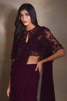 Burgundy sheer cape with bead and crystal embroidered floral jaal patterns. Comes with pre-stitched ruffle saree in solid tiered base. Comes with inner blouse. - Aza Fashions Embroidered Fitted Pre-draped Saree For Evening, Festive Draped Dress With Intricate Embroidery, Elegant Pre-draped Saree With Resham Embroidery And Cape Sleeves, Elegant Draped Dress With Resham Embroidery, Draped Party Dress With Intricate Embroidery, Evening Georgette Blouse With Intricate Embroidery, Evening Blouse With Intricate Embroidery In Georgette, Pre-draped Saree With Intricate Embroidery For Reception, Evening Blouse With Intricate Embroidery For Diwali