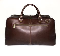 The leather travel bag is perfect for business or weekend trips. Suitable for men and women. Handmade, original design. Very light weight. Dimensions: * Height: 29 cm (11.42 inches) * Length: 50 cm (19.69 inches) * Width: 20 cm (7.87 inches) * Strap Drop length: max 130 cm (51.18 inches) Details: * One main part * Removable adjustable shoulder strap * Double leather handle * Two outside zipper pockets in the front of the bag * Zipper pocket inside * Two slip pockets inside Leather travel bag wit Brown Weekender Bag For Business Trips, Brown Business Weekender Bag With Luggage Sleeve, Brown Rectangular Business Duffle Bag, Rectangular Brown Business Duffle Bag, Brown Rectangular Business Weekender Bag, Brown Leather-lined Weekender Bag For Business Trips, Brown Satchel Duffle Bag For Business, Brown Large Capacity Weekender Bag For Business, Modern Brown Travel Bag For Business