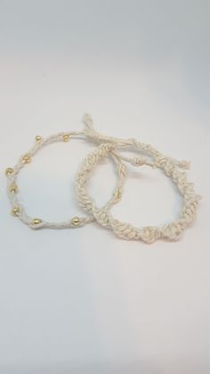 "Macrame Bracelet/ Adjustable Bracelet/Beaded Bracelet/ Charm Bracelet/Woven Bracelet/Cord Bracelet/Braided Hemp Bracelet Hemp Cord braided and beaded bracelet. The bracelet is braided with gold glass beads. The hemp is woven charm for stability and quality. The ends of all knots are glued with jewelry glue to insure quality as well. The bracelet will easily fit a wrist from 6\" to 9\" with ease in that it is adjustable and easy to wear! This piece makes a fun stacker bracelet and looks great wi White Handwoven Adjustable Bracelets, Minimalist Adjustable Macrame Braided Bracelet, Earthy Macrame Braided Bracelet Gift, Adjustable Hand-strung Hippie Braided Bracelets, Adjustable Macrame Braided Bracelet, Casual, Bracelet Cord, Hemp Bracelet, Hemp Bracelets, Woven Bracelet