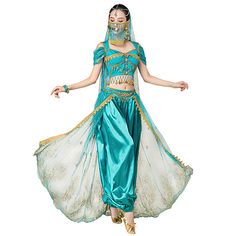 a woman in a blue and gold belly dance costume, with her arms spread out to the side