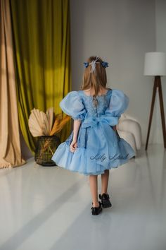 Looking for the perfect dress for your little princess's special occasion? Look no further than our Blue Glitter Tulle Tutu Dress! This stunning dress features layers of soft tulle, accented with sparkly glitter details for a touch of glamour. The full, twirly skirt is perfect for dancing the night away at a birthday party, prom, ball, or wedding. Our dress is also ideal for flower girls and pageants, with its elegant design and attention to detail. Crafted with love and care, this dress is sure Puffy Sleeve Dress, Tutu Birthday, Tulle Tutu Dress, Formal Wedding Guests, Twirly Skirt, Prom Ball Gown, Create Memories, Tulle Tutu, Birthday Tutu