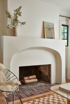 a living room filled with furniture and a fire place