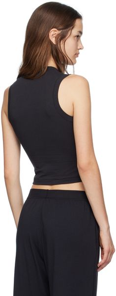 Breathable lightweight stretch cotton jersey tank top. Mock neck. Supplier color: Soot Fitted Crew Neck Tank Top For Loungewear, Stretch Cotton Athleisure Vest, Fitted Basic Tank Muscle Tee, Fitted Basic Muscle Tee, Fitted Sleeveless Tops For Loungewear, Basic Fitted Muscle Tank Tee, Fitted Basic Muscle Tank Tee, Black Cotton Racerback Top, Fitted Vest Tank Top For Loungewear