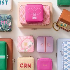 many different types of purses and wallets on display with the name crn printed on them