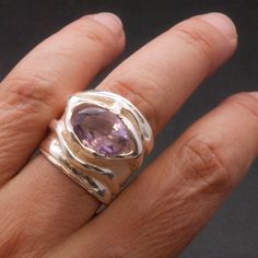 Unique Large Purple Amethyst Sterling Silver Wide Band Ring, Big Statement Designer Ring, Amethyst Jewelry Glamorous oversized ring with natural faceted purple amethyst February lucky birthstone ring gift 925 Sterling silver ring bandwidth: 23 mm front, 14 mm back Natural purple amethyst AAA quality: 14 x 8 mm oval Hallmarked 925 onto the inside of the ring Here you may find more Handmade Greek Fine Jewelry: http://www.sunsan.etsy.com ⭕Please kindly, prior to placing your order read carefully to Luxury Modern Silver Amethyst Ring, Luxury Silver Amethyst Ring Modern Style, Oversized Ring, Wide Band Ring, Amethyst Jewelry, Wide Band Rings, Wide Bands, Birthstone Ring, Purple Amethyst