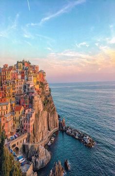 an aerial view of the town of cinque terrara on top of a cliff