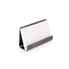 a white business card holder sitting on top of a table