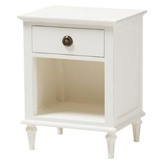 a white nightstand with an open drawer