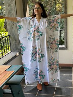 I made this Kaftan from a beautiful floral pattern in 100% mulmul cotton. Mulmul is a very fine variety of cotton which is extremely soft and it gets softer with every wash. It is so free flowing, that it will make you feel as if you aren't wearing anything at all ;) The beauty of the Kaftans is they will fit everyone so no need to worry about the size et all. All my Kaftans have deep necks(11-12 inches) so will fit all head sizes. However, the length of my kaftans will vary. I make all my kafta White Floral Print Sleepwear For Relaxation, Floral Print Sleepwear With Kimono Sleeves, White Printed Kimono For Loungewear, Summer Floral Print Kimono For Sleep, Summer Floral Print Sleep Kimono, Summer Sleepwear Kimono With Prints, Cotton V-neck Kimono For Loungewear, Cotton Sleepwear With Kimono Sleeves For Home, Printed Cotton V-neck Kimono