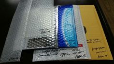 three different types of bubble wrap on top of each other with writing on the side