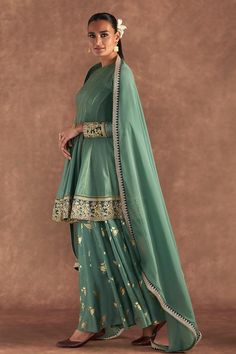 Moss green anarkali edged with kinari and embellished with border. Comes with irisbud foil printed sharara edged with kinari and a printed dupatta.
Components: 3
Pattern: Foil Printed, Embroidered
Type Of Work: Irisbud
Neckline: Round
Sleeve Type: Full
Fabric: Anarkali and Sharara- Raw Silk, Dupatta- Organza
Color: Green
Other Details: 
Disclaimer: The actual print-placement and colour of the product may vary slightly from the image shown.
Occasion: Sangeet - Aza Fashions Green Dola Silk Sharara For Reception, Designer Green Palazzo Set With Dupatta, Green Palazzo Set With Dupatta, Green Anarkali Palazzo Set With Zari Work, Designer Anarkali Palazzo Set In Green, Designer Green Anarkali Palazzo Set, Pista Green Sharara With Dabka Work And Traditional Drape, Pista Green Sharara With Dabka Work, Green Anarkali Sharara For Festive Occasions