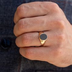 Men's onyx signet ring. You can wear this ring everyday. The black onyx stone makes the ring special. FREE EXPRESS INTERNATIONAL SHIPPING! SHIPPING NEXT DAY! PRODUCT DETAILS * 14K REAL GOLD ( it has a 14K or 585 stamp on item.) All of my items are 14k real gold. I don't use any gold filled or gold plated materials.  * All of my items are brand new and shipped with a gift box.  * The package includes a gold certificate. * Gold Color Options; Yellow Gold, White Gold, Rose Gold * Onyx Stone Measure Mens Gold Onyx Ring, Gold Onyx Ring Men, Classic Round Signet Ring With Black Enamel, Modern Black Oval Signet Ring, Classic Black Engraved Ring In 14k Gold, Classic Black 14k Gold Engraved Ring, Classic Black Engraved 14k Gold Ring, Black 14k Gold Engraved Ring, Black Engraved 14k Gold Ring