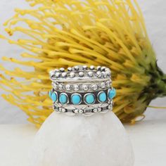 "It's the perfect complimentary ring to our stackable silver rings.  This sterling silver band has turquoise stones set all the way around the ring.  It is beautiful and quickly becoming one of our favorite bands. If you would like to purchase the infinity opal band in some of the pictures, please see this listing: https://www.etsy.com/ToozyStudio/listing/1506329919 ♥♥ HOW TO ORDER ♥♥ 1. The base price is for the turquoise ring only.  In the dropdown you can select to add silver band rings.   2.  IN THE PERSONALIZATION BOX AT CHECKOUT PLEASE INCLUDE WHAT BANDS DO YOU WANT? (see the thumbnail pictures for the names of each band)      3. PLEASE INCLUDE YOUR PHONE NUMBER IN THE COMMENTS SECTION SO THAT WE MAY REACH YOU WITH ANY QUESTIONS REGARDING YOUR ORDER.  4.  If you want us to feature yo Bohemian Adjustable Stackable Turquoise Ring, Adjustable Stackable Bohemian Turquoise Ring, Bohemian Stackable Blue Turquoise Ring, Bohemian Stackable Turquoise Ring, Bohemian Blue Stackable Turquoise Ring, Adjustable Stackable Turquoise Midi Rings, Blue Bohemian Stackable Rings, Bohemian Adjustable Turquoise Stackable Rings, Bohemian Blue Handmade Stackable Rings