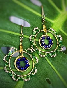 Brass ear hook and circle with rondelle beads. Made to order: Allow for 1 to 3 days to make and ship. Iridescent Green, Earrings Beaded, Ear Hook, Gorgeous Gift, Circle Earrings, Wire Wrapped, Wire Wrapping, Cobalt, Jewelry Earrings Dangle