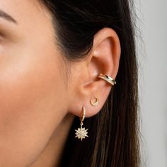 "Pavé huggie hoops with a dainty north star charm. Beautiful and delicate, these tiny hoops are total stunners on their own but also looks gorgeous layered up with other minimal earrings. ∙ Sold individually (1 hoop) or by pair (2 hoops) * D E T A I L S * ∙ Material: .925 Sterling Silver or 18K Gold Plated over .925 Sterling Silver ∙ Stone: White Zirconia ∙ Dimensions: Hoop diameter: 11mm // Star charm: 11mm ∙ Hypoallergenic & nickel-free * P A C K A G I N G * ∙ All jewelry is sent out beaut Celestial Huggie Pierced Earrings, Celestial Star Huggie Earrings, Celestial Single Earring For Everyday Wear, Celestial Style Huggie Earrings With Star Charm, Everyday Star Cartilage Earrings, Everyday Celestial Earrings With Star Charm, Celestial Star Charm Earrings For Everyday, Celestial Small Hoop Huggie Earrings, Dainty Star-shaped Hoop Earrings For Everyday