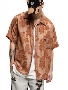 This is a casual and unique shirt with short sleeves that is made out of high quality polyester 100% fabric. With design detail of light fabric with flower pattern and oversized silhouette, it gives a comfortable and trendy mood.- RSCC Logo metal emblem on the chest- Light fabric with flower pattern- Rough fringe detail- Logo engraved buttons detail Oversized Half Sleeve Summer Shirt, Oversized Brown Shirt For Spring, Casual Brown Hawaiian Shirt For Summer, Trendy Relaxed Fit Hawaiian Shirt With Short Sleeves, Trendy Relaxed Fit Short Sleeve Hawaiian Shirt, Casual Short Sleeve Shirt With Floral Print, Oversized Patterned Summer Tops, Brown Relaxed Fit Camp Shirt For Summer, Oversized Patterned Top For Summer