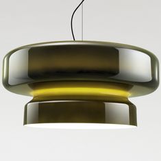 a green and yellow light hanging from a ceiling