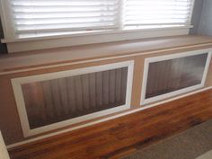 the window sill is made out of wood and has two windows on each side