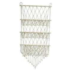 a white macrame hanging from the ceiling