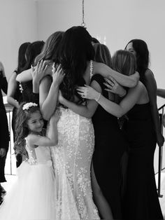 a group of women standing next to each other