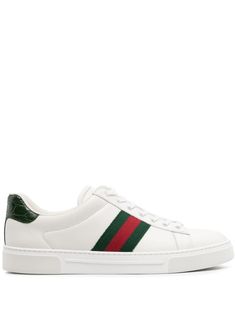 white leather signature Web-stripe trim contrasting branded heel counter decorative plaque round toe front lace-up fastening branded leather insole flat rubber sole This piece comes complete with a protective dust bag. Women's Gucci sneakers fit large. For the most comfortable fit please select half a size down. We've partnered with Good On You — an independent agency that rates how brands perform in relation to their impact on the planet, people and animals, with a multi-criteria rating simplif Gucci Elegant, Gucci Ace Sneakers, Gucci Sneakers, Planet People, White Leather Sneakers, Sneaker Games, Leather Cap, Comfortable Flats, Beach Tote Bags