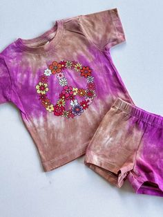 Discover the perfect ensemble for your little fashionista with our trendy toddler girl outfit sets on Etsy! Our matching sets for babies and toddlers are the epitome of style and comfort, featuring adorable two-piece combinations that are sure to make your child stand out. Dive into our collection of trendy girly outfits, including the must-have floral peace sign shirt for girls, paired with chic biker shorts. Each set showcases a unique violet and beige tie-dye design, adding a splash of color Floral Peace Sign, Peace Sign Shirt, Outfits Floral, Peace Sign Shirts, Toddler Girl Outfit, Tie Dye Designs, Girly Outfits, Biker Shorts, Peace Sign