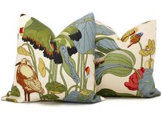 two pillows with birds and flowers on them