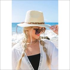 Beaded Belt Straw Panama HatDetailsBeaded or Embroidered Belt AccentSuede TieMaterial: 100% strawBrim length: 3.25" Style: Fedora hat Embellishment: Bead or Embroidered Belt Material Composition: 100% strawSuede Tie White Summer Hat Bands For Vacation, White Summer Hat Band For Beach, Summer Cream Hat Band For Vacation, Summer Vacation Cream Hat Band, Vacation Straw Fedora With Braided Detail, White Straw Hat Bands For Beach, Woven Fedora For Beach Season, Bohemian Cream Hat Band For Beach, Vacation Braided Straw Fedora