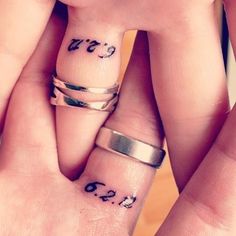 two people with matching rings on their fingers