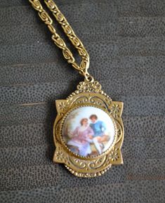 ***This vintage  necklace is made with a porcelain  pendent .(LIMOGES LOOK )***Porcelain is hand painted with a picture of a couple. ***Swirl design on the chain. Comes with extra extension chain. ***Entire necklace is 24.75' long. (untied.) Extension link alone is 5'' long. ***Pendent is just over 1'' long. Vintage Hand Painted Necklaces For Gift, Vintage Hand Painted Necklace As Gift, Hand Painted Vintage Necklace As Gift, Hand Painted Vintage Necklace For Gift, Vintage Hand Painted Pendant Necklace, Vintage Hand-painted Pendant Necklace, Vintage Hand Painted Round Pendant Necklace, Vintage Hand Painted Pendant Jewelry, A Picture Of A Couple