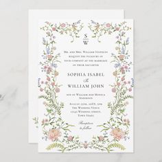 a wedding card with flowers and vines on the front, in pastel pinks