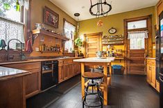 a kitchen with wooden cabinets and an island