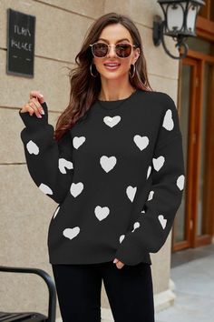 Long Sleeve Heart Tunic Sweater Cute heart tunic sweater for Valentines Day! PRODUCT DESCRIPTION - Long sleeve heart tunic sweater PRODUCT DETAILS Pattern type: Heart pattern Style: Casual Features: Ribbed Neckline: Round neck Length: Regular Sleeve length: Long sleeves Sleeve type: Dropped shoulders Material: 50% viscose, 28% polyester, 22%, nylon Stretch: Slightly stretchy Sheer: No Body: Not lined Care instructions: Machine wash cold. Tumble dry low. Product measurements: S: bust 41 in, sleev Trendy Long Sleeve Top With Heart Print, Casual Heart Print Winter Tops, Trendy Heart Print Tops For Fall, Long Sleeve Heart Graphic Sweater For Fall, White Heart Sweater For Winter, Trendy Heart Print Sweater For Winter, Casual Heart Print Sweater For Winter, Trendy Heart Print Tops For Winter, Trendy Heart Graphic Sweatshirt For Winter