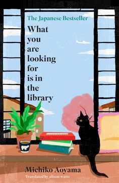 a black cat sitting on top of a window sill next to a stack of books