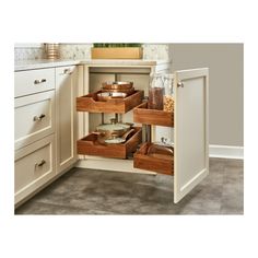 an open cabinet in the corner of a kitchen with drawers and spice jars on it