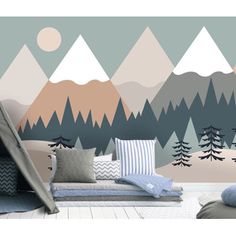 a bedroom with mountains and trees painted on the wall in pastel colors, along with pillows