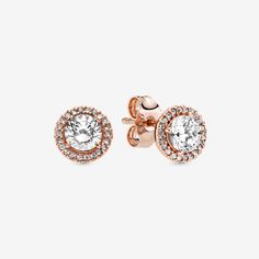 When you want classic elegance and a dose of drama, reach for these Round Sparkle Halo Stud Earrings. With a distinctly vintage feel, the 14k rose gold-plated, hand-finished pieces are centred with a brilliant cubic zirconia that is surrounded by a halo of smaller stones. The earrings work with everything, day or night. Try styling them with the corresponding pendant necklace, inspired by antique jewellery box treasures. - Pandora Round Sparkle Halo Stud Earrings - 14k Rose gold-plated unique metal blend / Cubic Zirconia / Clear