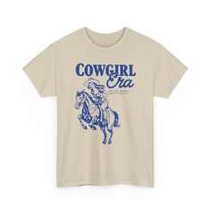 Channel your inner western babe with our Cowgirl Era Graphic Tee. This vintage-inspired graphic tee features a relaxed fit and dropped shoulders for a modern look that goes anywhere. Made from 100% cotton for breathable comfort, it's the perfect way to add a touch of Western flair to your everyday style. Trending Now, Matching Sets, Bridal Accessories, Everyday Fashion, Vintage Inspired, Graphic Tees, Relaxed Fit, T Shirt