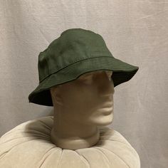 Elevate your summer style with our Dark Green Linen Bucket Hat, a versatile and handmade accessory perfect for beach days, garden outings, or any sunny adventure. This fisherman hat is not just a fashion statement; it's a practical and stylish addition to your summer wardrobe. Discover The Versatility of Our Hats: -Classic and breathable linen construction -Women's beach linen hat for a touch of elegance -Fisherman hat design for a timeless appeal -Handmade cotton hat for a personalized touch -Unisex summer hat suitable for various occasions -Ideal gift for Christmas or birthdays Discover the effortless charm of our summer linen hat, designed to provide both style and comfort. The vibrant dark green hue adds a pop of color to your ensemble, making it the perfect companion for sunny days. S Lightweight Khaki Brimmed Hat, Khaki Bucket Hat For Outdoor Summer Activities, Khaki Bucket Hat For Summer Outdoor Activities, Khaki Bucket Hat For Summer Outdoors, Lightweight Khaki Hat With Curved Brim, Adjustable Lightweight Khaki Sun Hat, Lightweight Khaki Summer Hat, Khaki Bucket Hat For Spring, Khaki Brimmed Cotton Bucket Hat