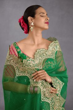 Editor's Note Featuring a rich green silk organza saari finished with scallop border along with bhagalpuri printed sweetheart neck blouse Color: Green Fabric: Silk organza Components: Sari and blouse Fit: Fitted at bust Occasion: Haldi mehndi and wedding guest Care: Dry Clean Only About the Designer Torani by Karan Torani stands handcrafted luxury inspired by the myriad tales of Indian mythology. Torani is a potpourri of all things nostalgic that binds you with a memory long forgotten. The label Sweetheart Neck Blouse, Blouse Yoke, Tuxedo Accessories, Scallop Border, Photo Awards, Indian Textiles, Organza Saree, Fancy Sarees, Silk Organza