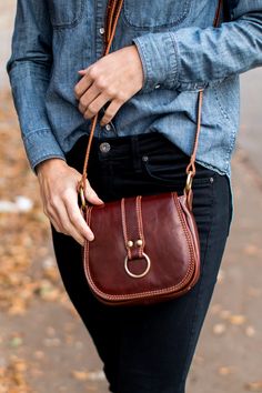 Venezia Saddle Bag is made with full grain leather. The calfskin leather for this bag was vegetable tanned in Tuscany to create rich color tones while the semi gloss finish helps prevent stains. Classic Soft Leather Saddle Bag For On-the-go, Classic Saddle Shoulder Bag For Everyday, Chic Saddle Bag For Daily Use, Fall Satchel With Top Handle And Leather Lining, Fall Top Handle Satchel With Leather Lining, Brown Saddle Bag For Daily Use In Fall, Classic Everyday Saddle Bag For Fall, Everyday Rectangular Saddle Bag With Leather Trim, Everyday Saddle Bags With Leather Handles