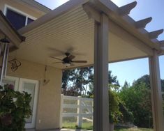 a ceiling fan on the outside of a house