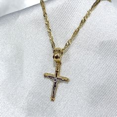 14K Gold Crucifix Cross Pendant With 1.2MM Singapore Chain Religious Charm Necklace, Christian Jewelry Gift  ✅ PENDANT SPECIFICATIONS:  * Single Sided * Height: 0.59 in. (15 MM) * Width: 0.39 in. (10 MM) * Average Weight: 0.4 gr. ✅ CHAIN SPECIFICATIONS:  * Clasp: Spring-Ring  * Width: 1.2 MM ➤ Length: 16 inches   Avg Weight: 1.04 ➤ Length: 18 inches   Avg Weight: 1.12 ➤ Length: 20 inches   Avg Weight: 1.26 ➤ Length: 22 inches   Avg Weight: 1.35 ➤ Length: 24 inches   Avg Weight: 1.42 ✅SHIPPING CONTENTS: -14K Gold Pendant & Chain -Jewelry Box ✅ PREMIUM 14K GOLD:  Our jewelry is crafted from durable high quality materials, gems, and stones; hand-stamped for authenticity as well as FTC law approved. Unlike cheap costume jewelry, our long lasting jewelry is easy to polish and and won't permanen Gold Plated Tarnish Resistant Crucifix Necklace, Gold Plated Crucifix Necklace Tarnish Resistant, Gold-plated Tarnish-resistant Crucifix Necklace, Gold-plated Cross Pendant Necklace With Chain, Gold Plated Cross Chain Jewelry, Gold Plated Chain Cross Jewelry, Gold Chain Cross Necklace For Gift, Figaro Chain Cross Necklace As Gift, Gift Jewelry Chain With Crucifix Shape